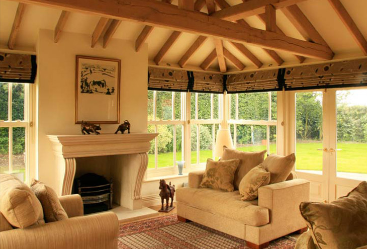 House interior with oak beamed vaulted ceiling